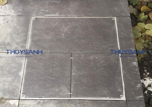 Nắp đậy bể nước ngầm ngoài trời lát gạch hài hoài với không gian nền
